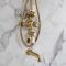 Duschsäule mit Aufputz-Thermostat - inkl. 194mm rundem Duschkopf, Handbrauseset und Wand-Wanneneinlauf – satiniertes Gold – Elizabeth